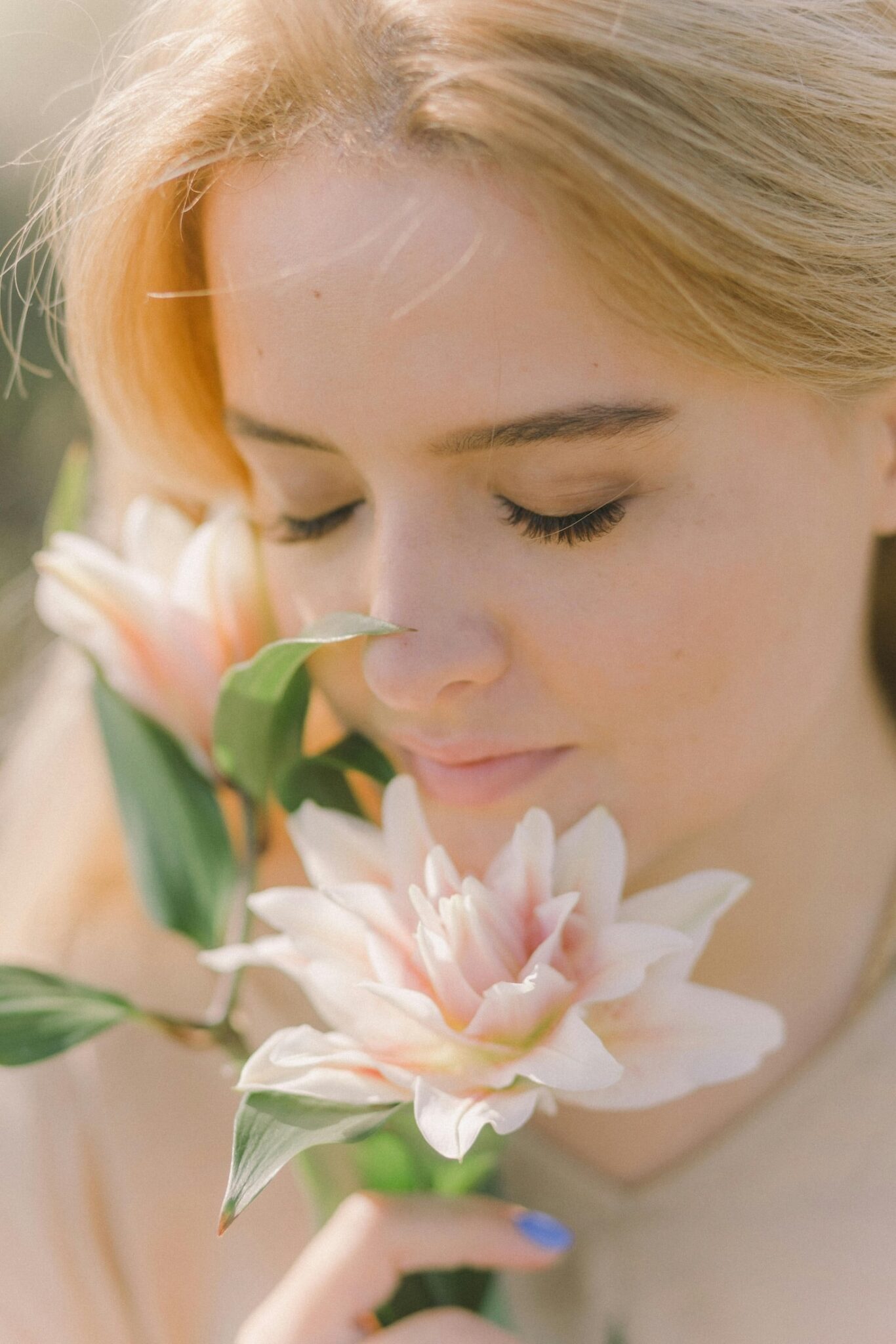 woman smelling flower